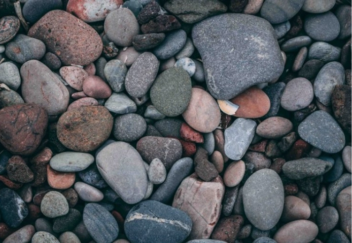 Close-up of various colored smooth rocks.