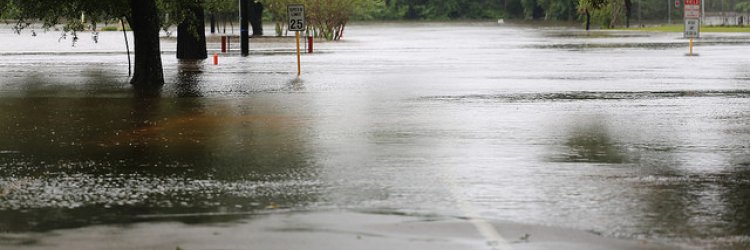 A parking lot flooded with rain.