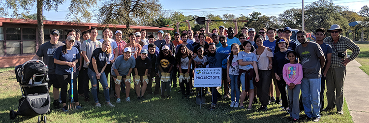 Large group of volunteers at a Keep Austin Beautiful project site.