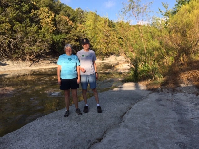 Two Keep Austin Beautiful Beautify Bash awardees standing at the Greenbelt.